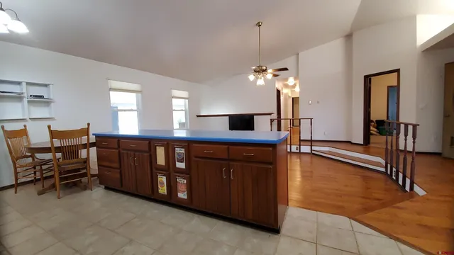 a view of a room with furniture and a chandelier