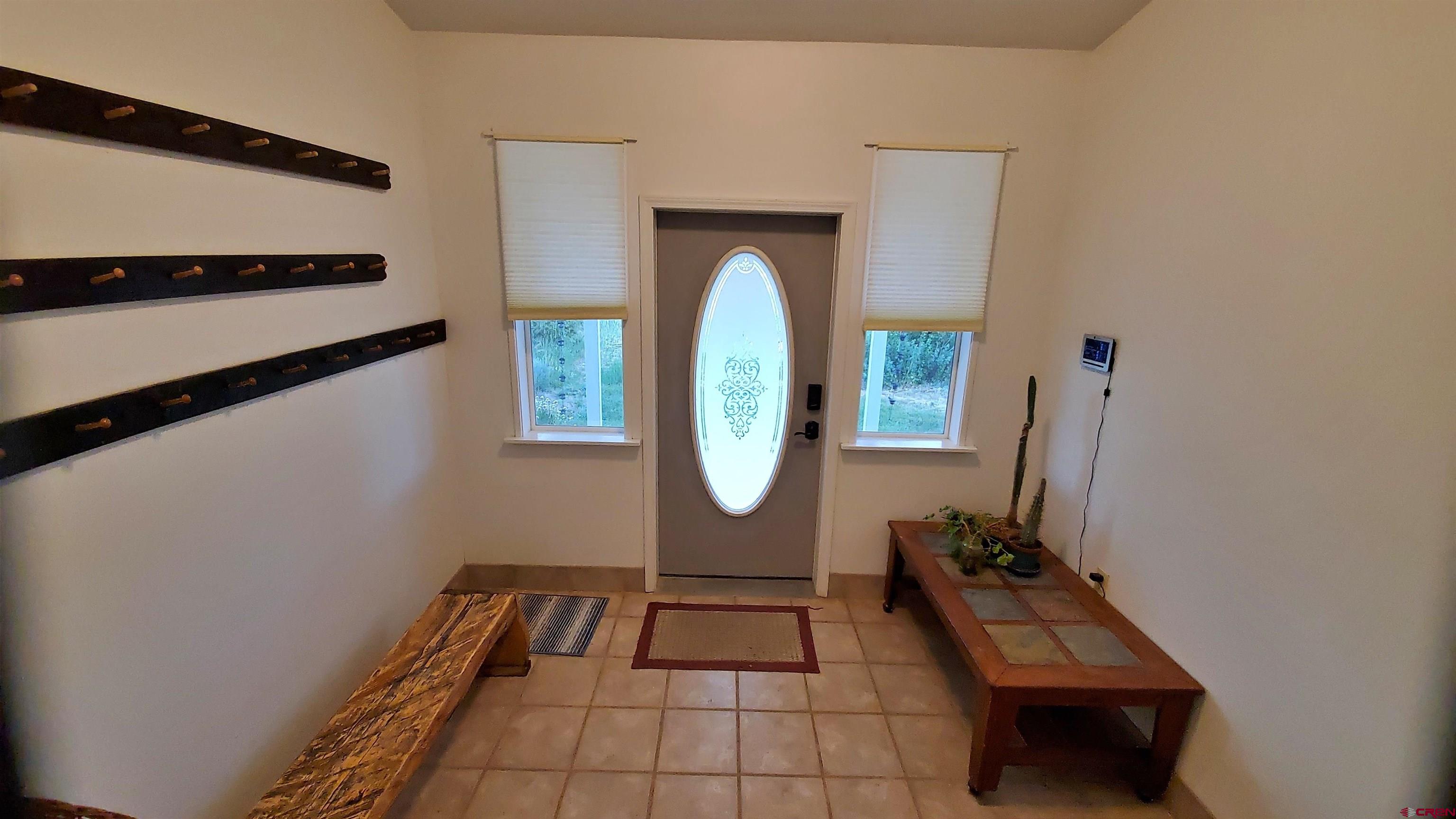 22250 County Rd M Cortez, CO 81321 - Photo 9 of 45 a room with window and a table