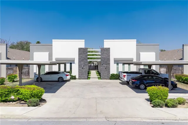a view of a building and car parked
