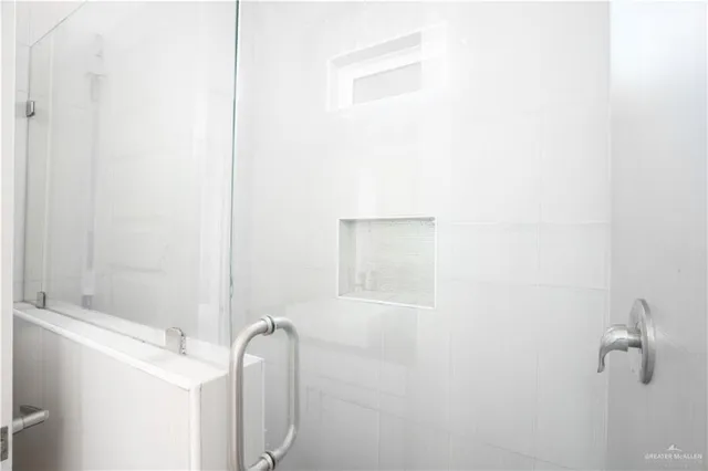 a bathroom with a granite countertop sink and