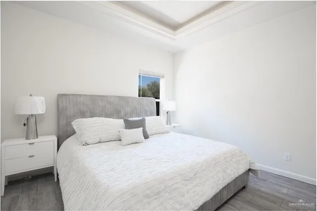 a bedroom with a bed and a lamp