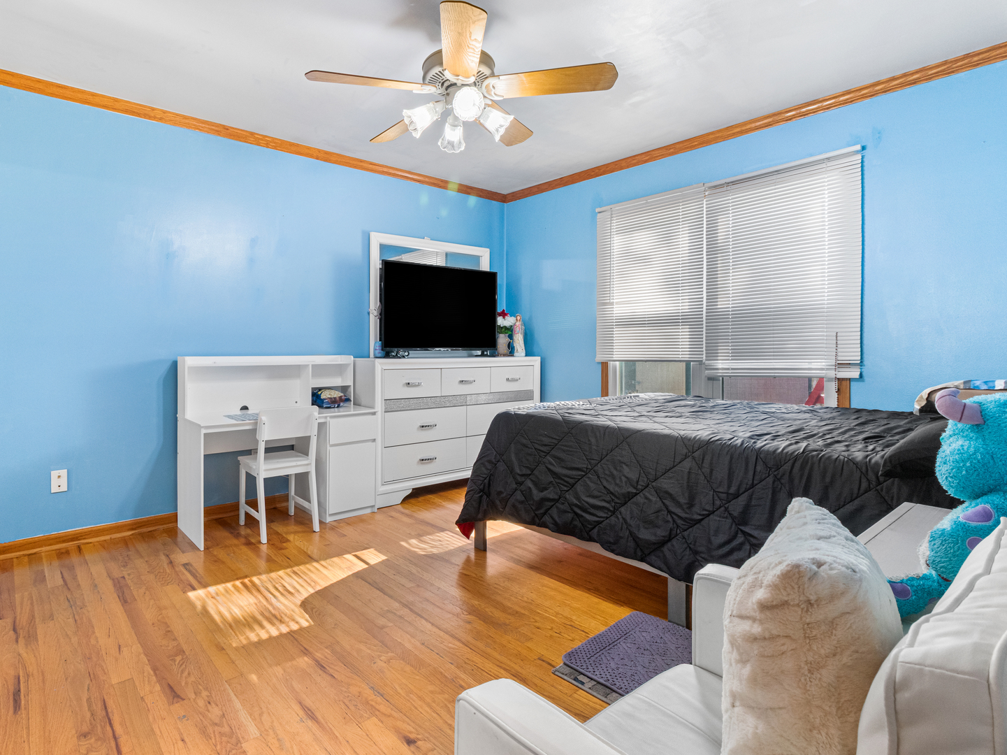 215 Fernwood Road Montgomery, IL 60538 - Photo 13 of 28 a bedroom with a bed and a flat screen tv