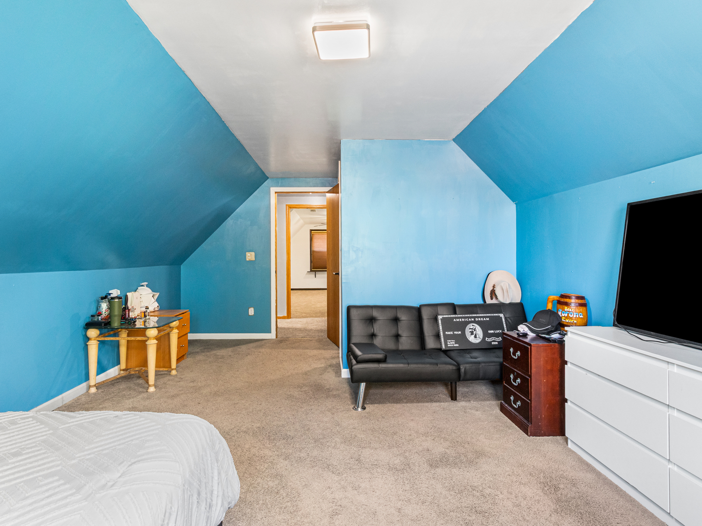 215 Fernwood Road Montgomery, IL 60538 - Photo 14 of 28 a bedroom with furniture and a flat screen tv