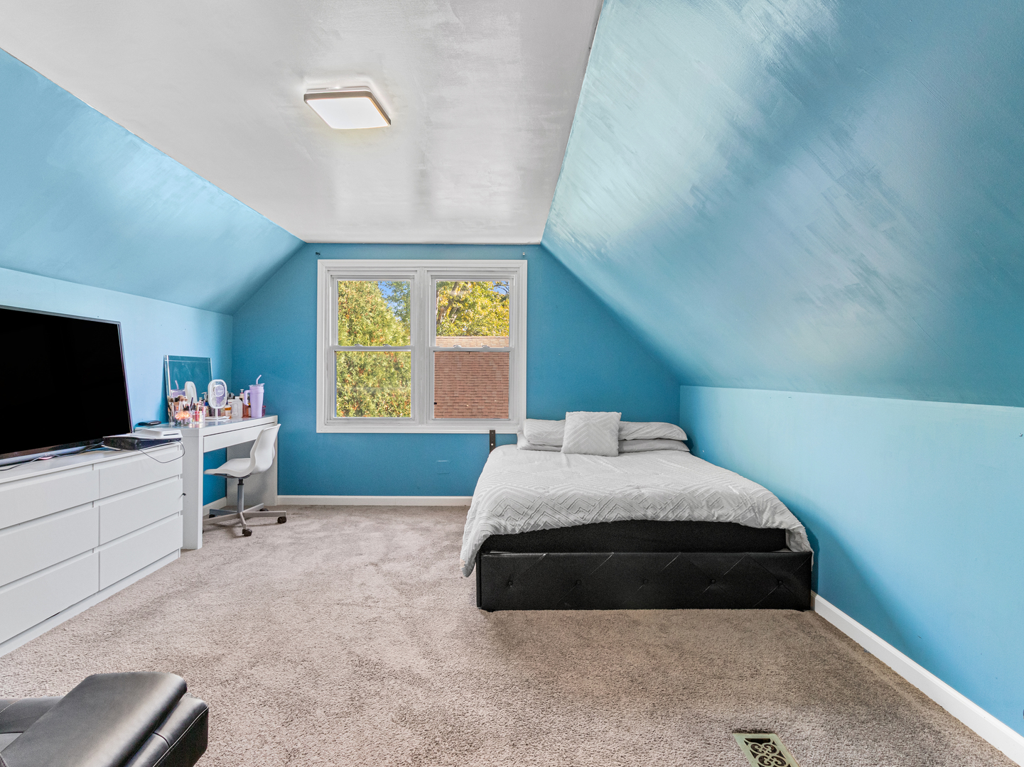 215 Fernwood Road Montgomery, IL 60538 - Photo 15 of 28 a bedroom with a bed and flat screen tv