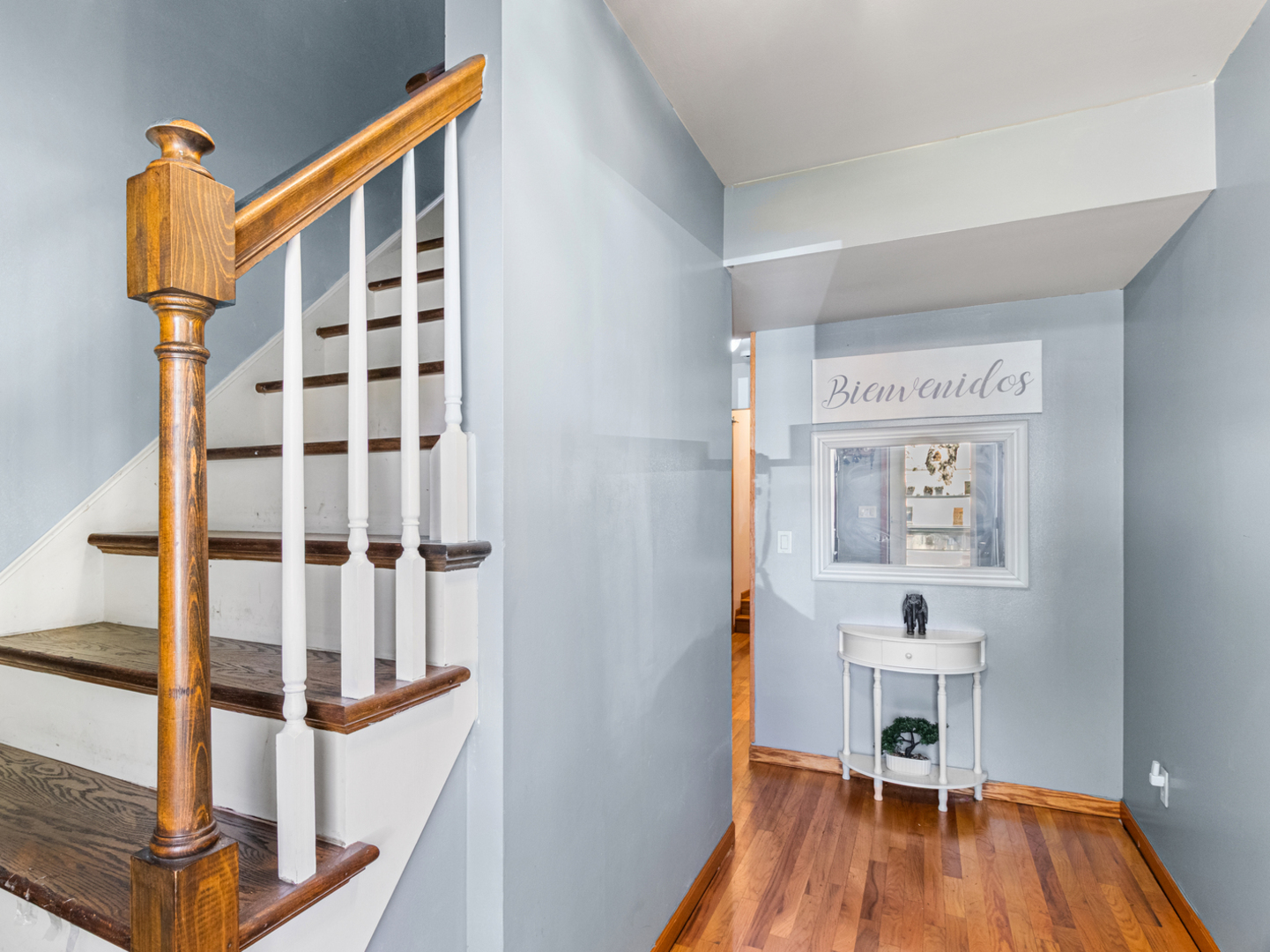 215 Fernwood Road Montgomery, IL 60538 - Photo 2 of 28 a view of a hallway with wooden floor and staircase