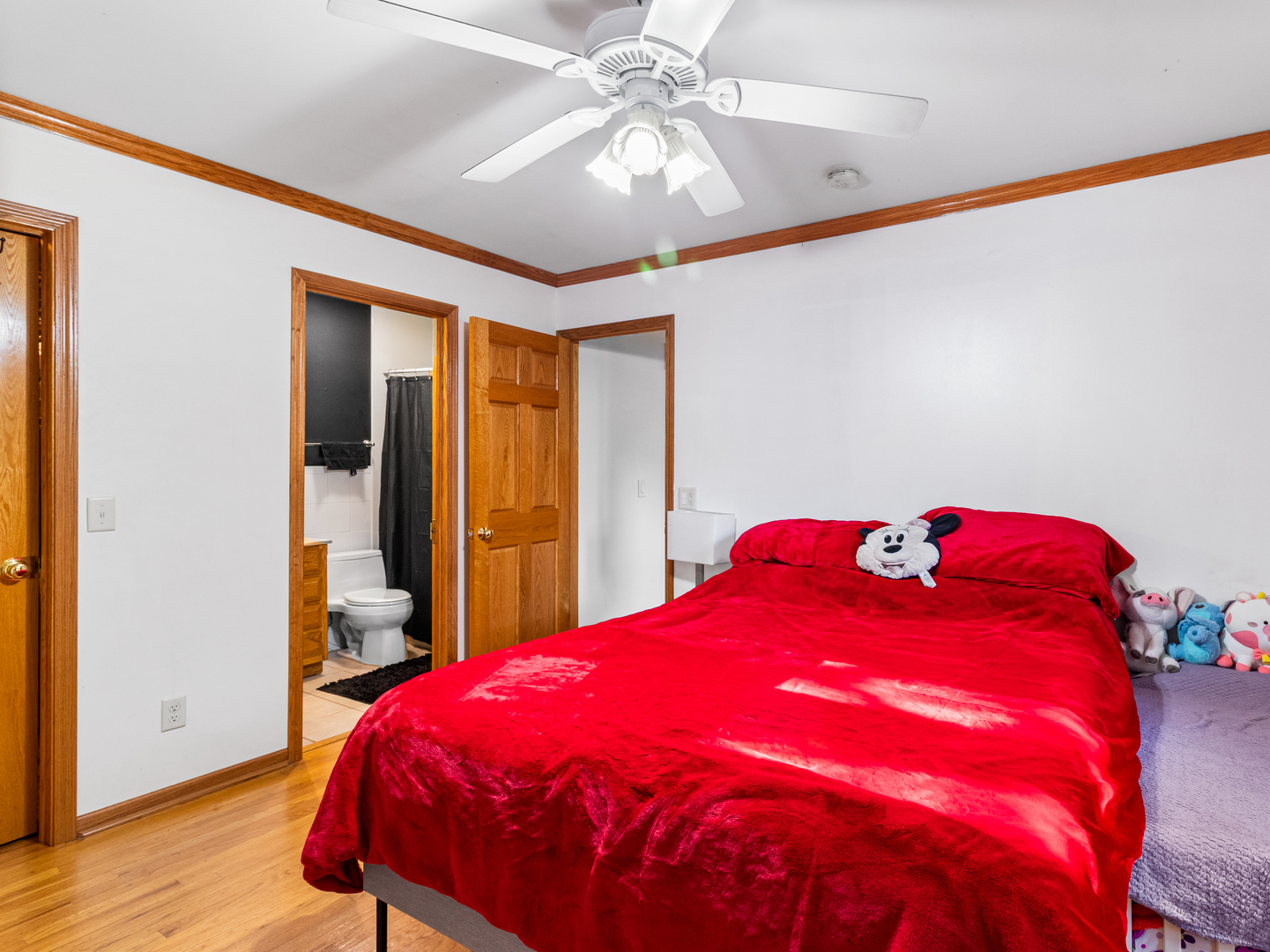 215 Fernwood Road Montgomery, IL 60538 - Photo 10 of 28 a bed sitting in a bedroom next to a window