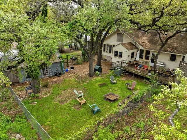 a green field with lots of trees