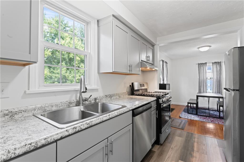 21 Circle Drive Beaver, PA 15009 - Photo 20 of 30 a kitchen with a sink stove top oven and cabinets
