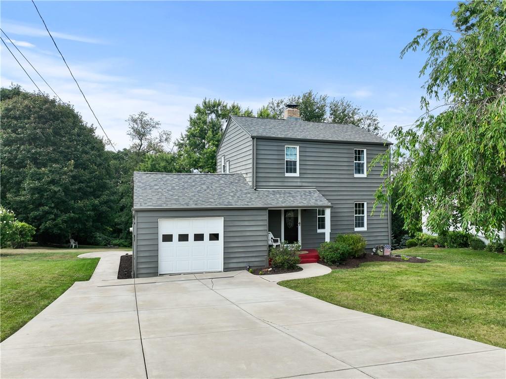 21 Circle Drive Beaver, PA 15009 - Photo 2 of 30 a front view of a house with a yard and trees