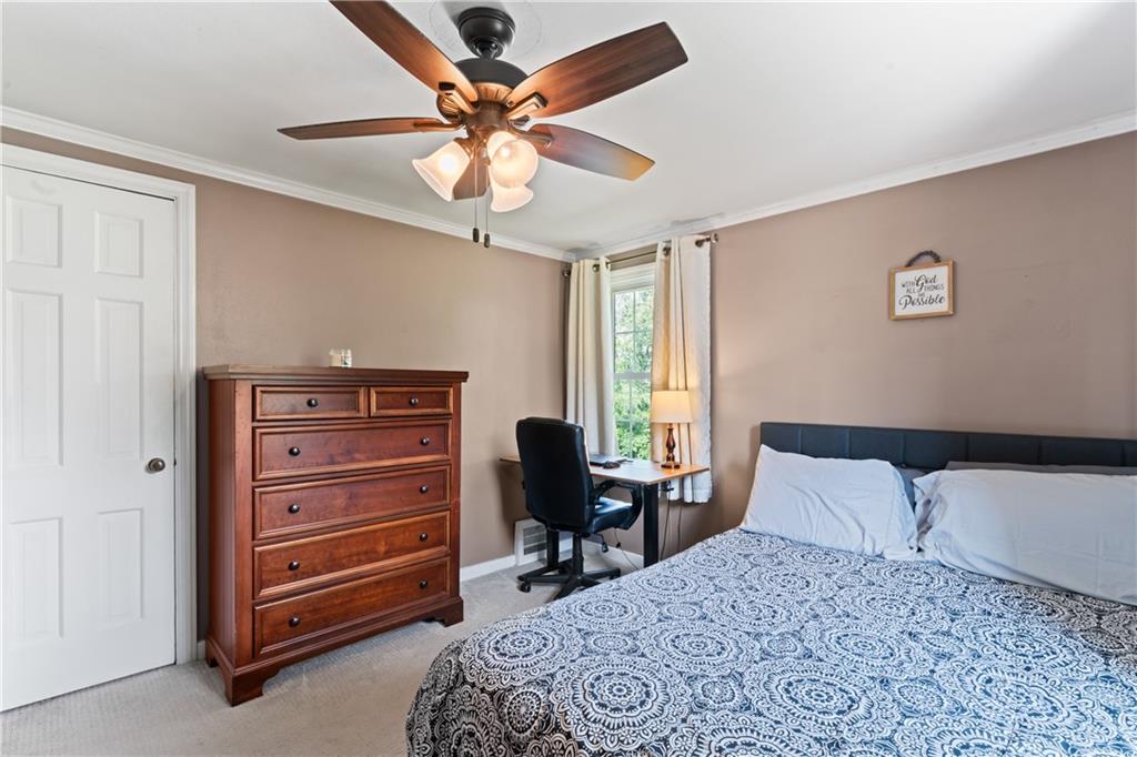 21 Circle Drive Beaver, PA 15009 - Photo 23 of 30 a bedroom with a bed and a chandelier