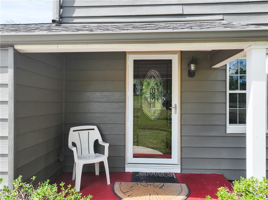 21 Circle Drive Beaver, PA 15009 - Photo 4 of 30 a front view of a house with wooden floor and a potted plant