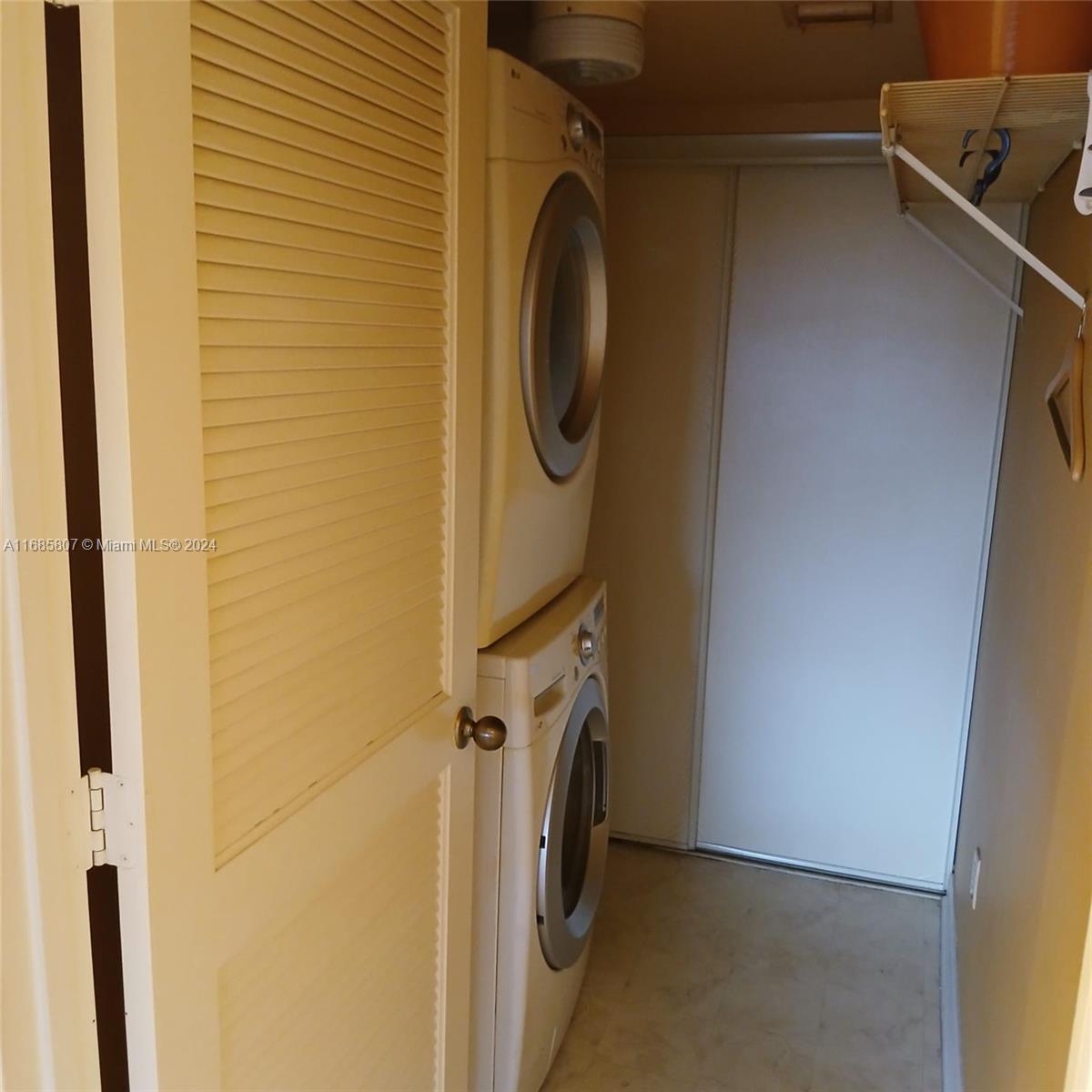 7136 South Devon Drive, Unit 207 Tamarac, FL 33321 - Photo 14 of 24 a utility room with dryer and washer