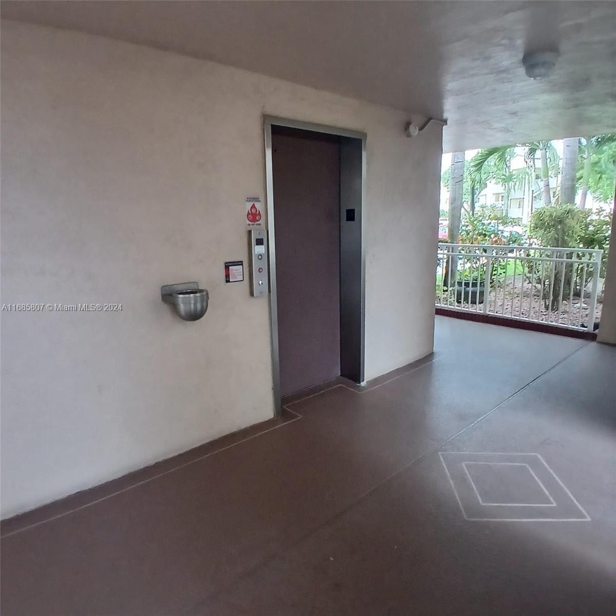 7136 South Devon Drive, Unit 207 Tamarac, FL 33321 - Photo 6 of 24 an empty room with windows