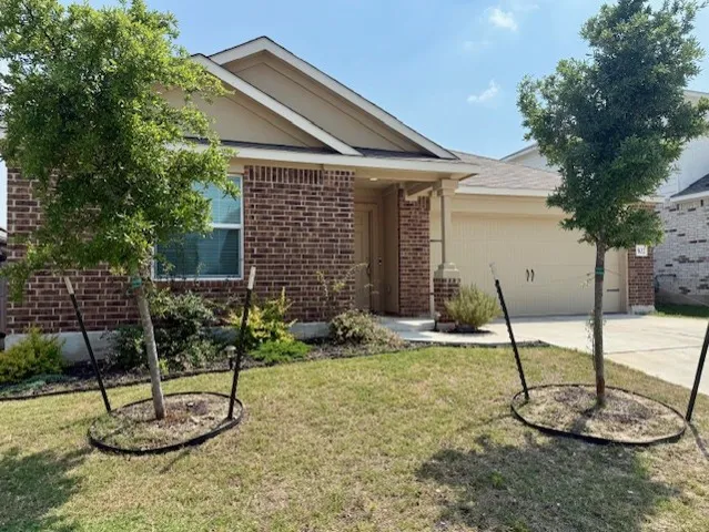 a backyard with table and chairs