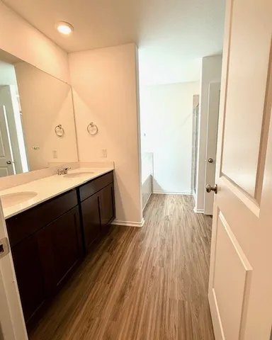 a en suite bathroom with a sink and a mirror