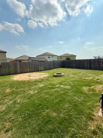 a view of a lake with houses in the back