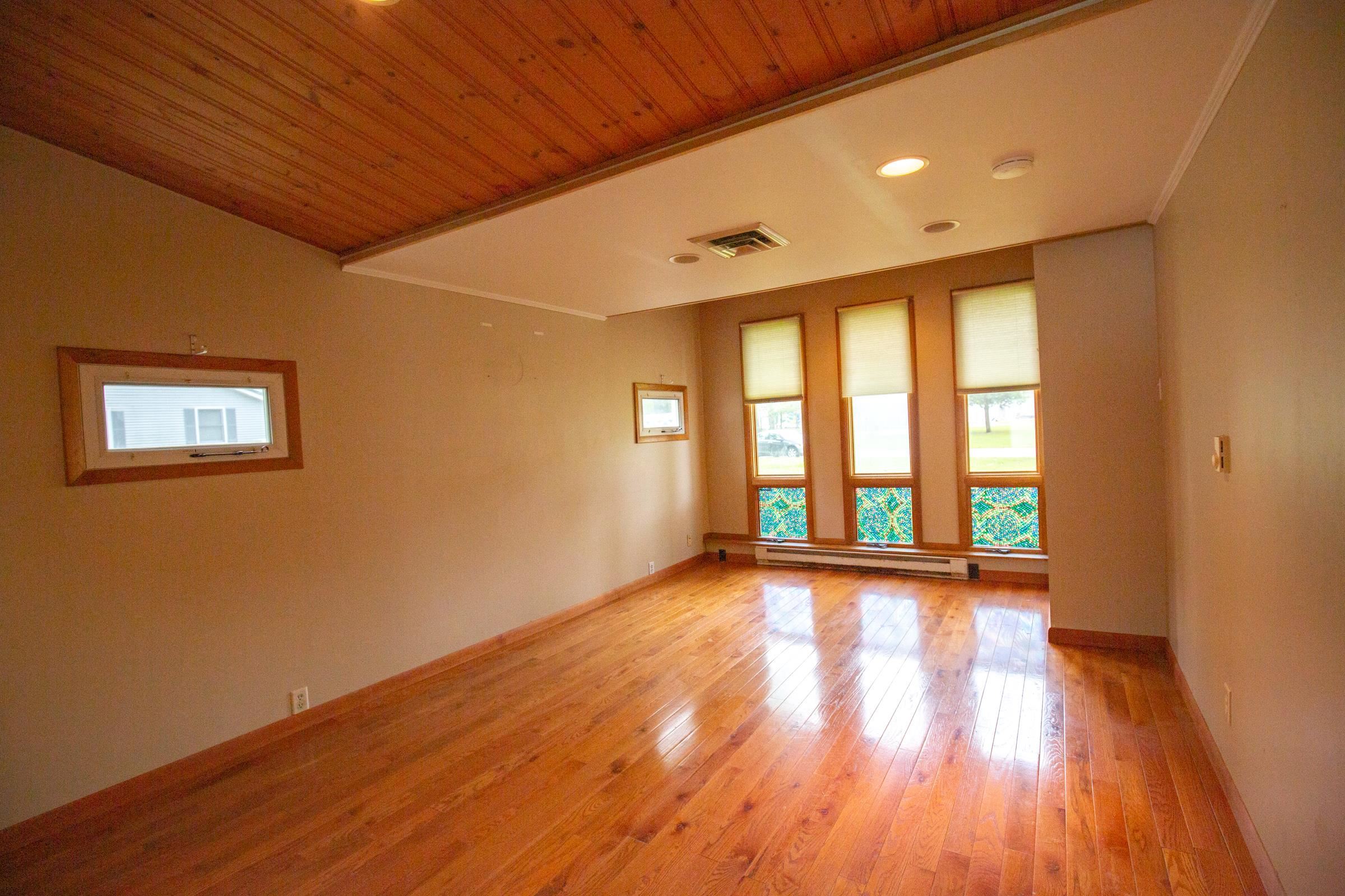 312 Ridge Cape May, NJ 08204 - Photo 13 of 32 a view of an empty room with wooden floor and a window