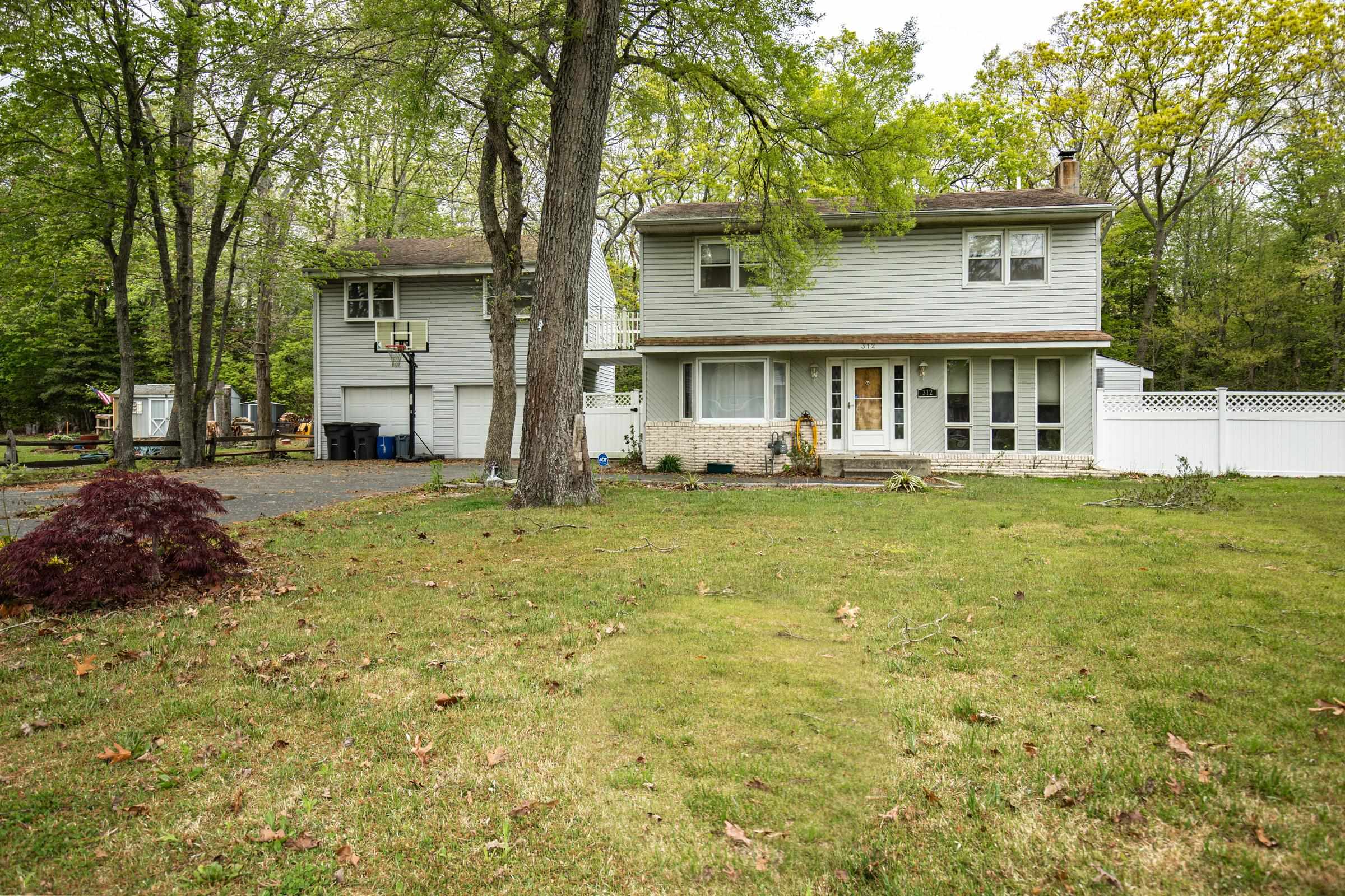 312 Ridge Cape May, NJ 08204 - Photo 2 of 32 a front view of a house with a garden