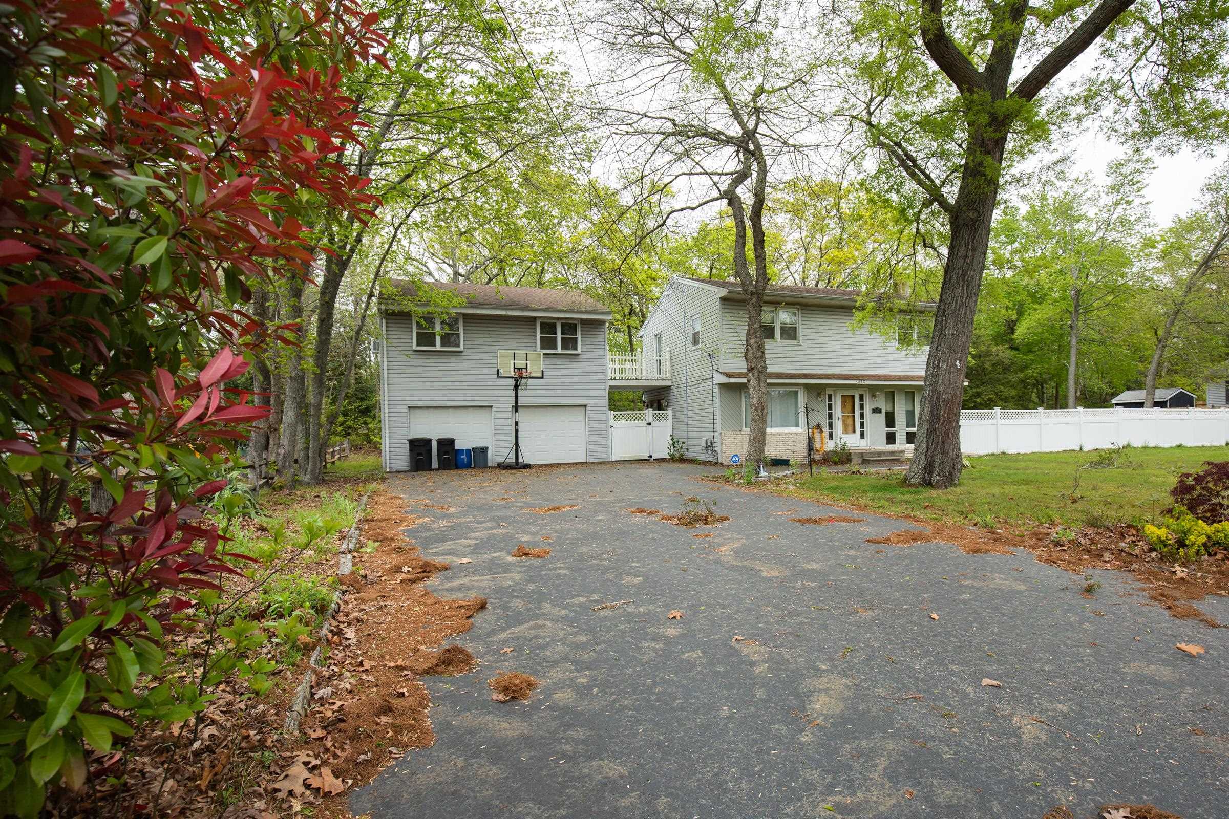 312 Ridge Cape May, NJ 08204 - Photo 3 of 32 a view of a house with a yard and garage
