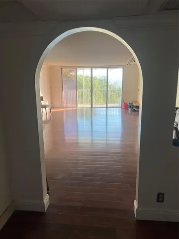 a kitchen with a refrigerator and window