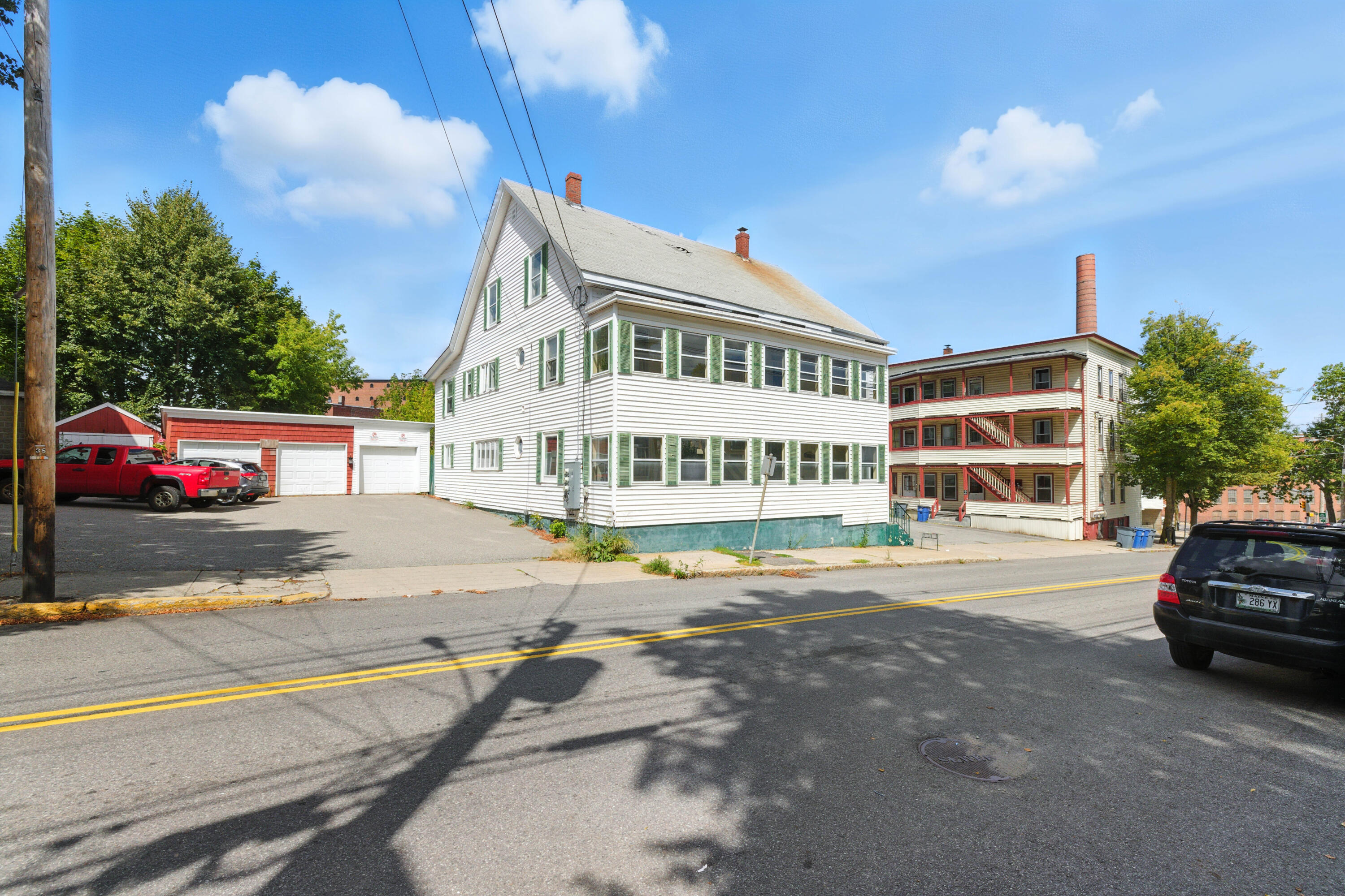 16 Hill Street Biddeford, ME 04005 - Photo 40 of 40 Side, 1-bay garage on left