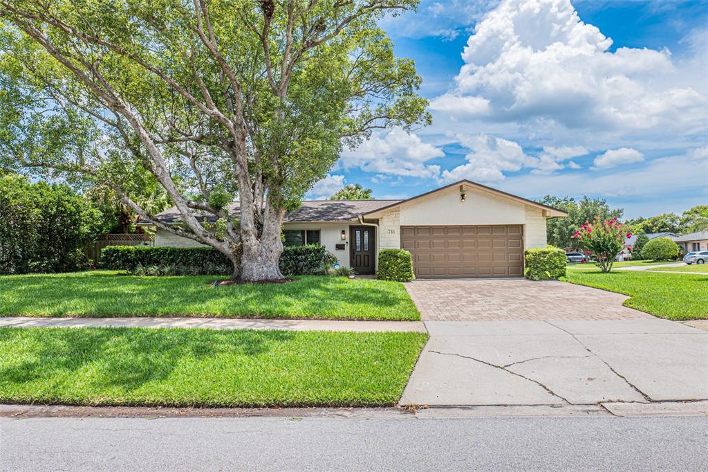 741 Brookside Road Maitland, FL 32751 - Photo 2 of 43 a front view of a house with a yard and garage