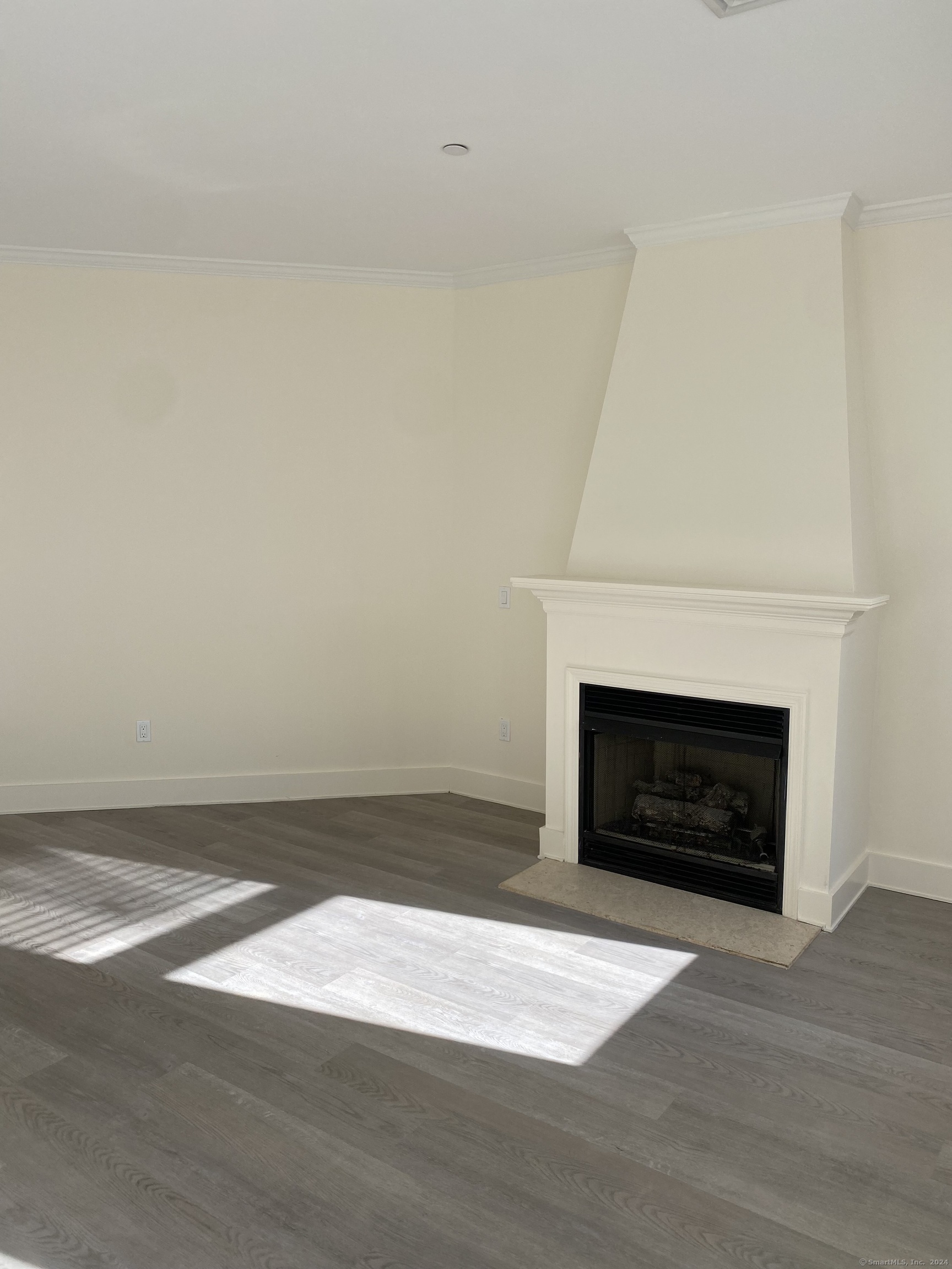 75 Prospect Street Stamford, CT 06901 - Photo 11 of 15 a living room with a fireplace