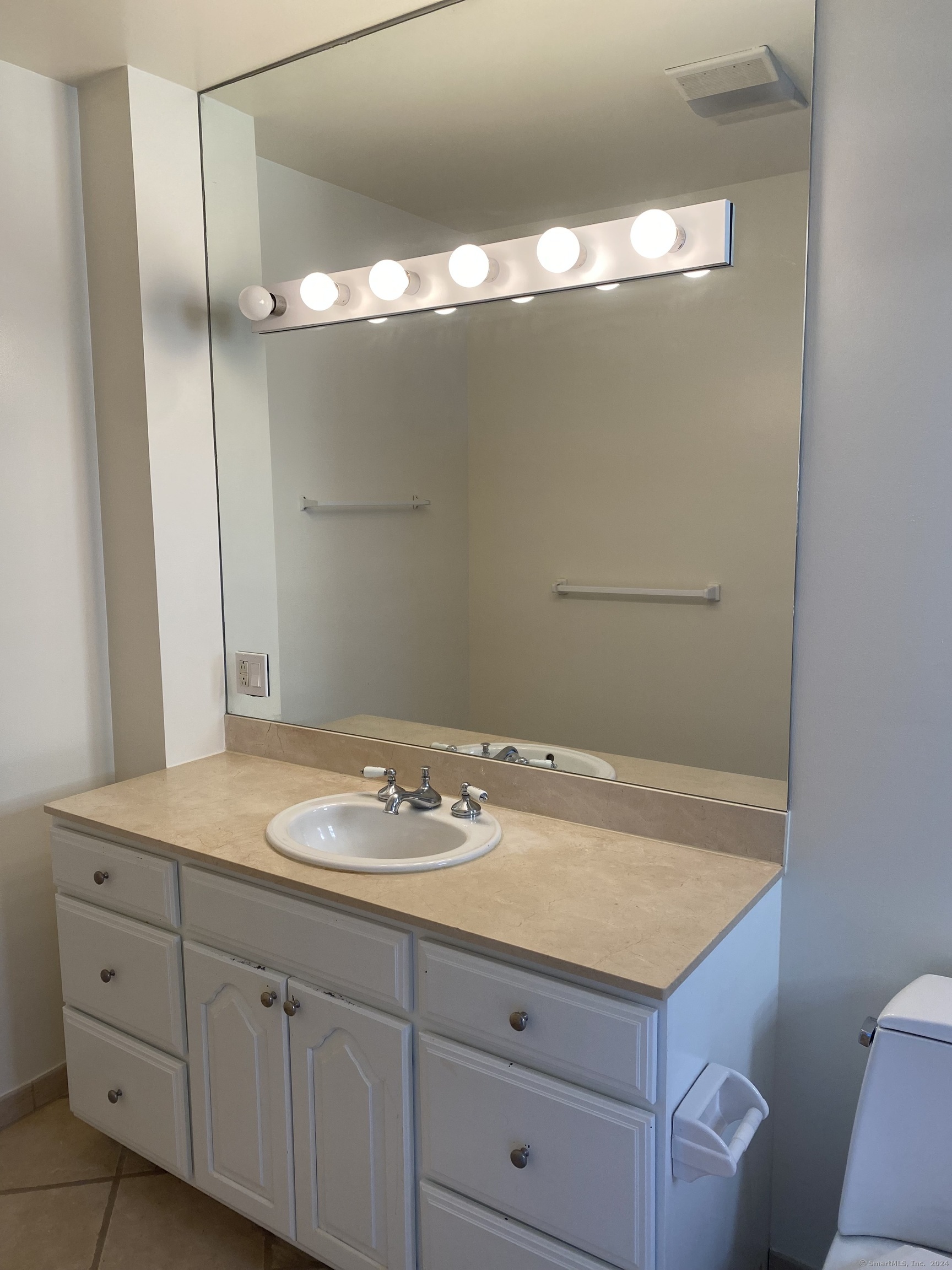 75 Prospect Street Stamford, CT 06901 - Photo 14 of 15 a bathroom with a granite countertop sink and a mirror