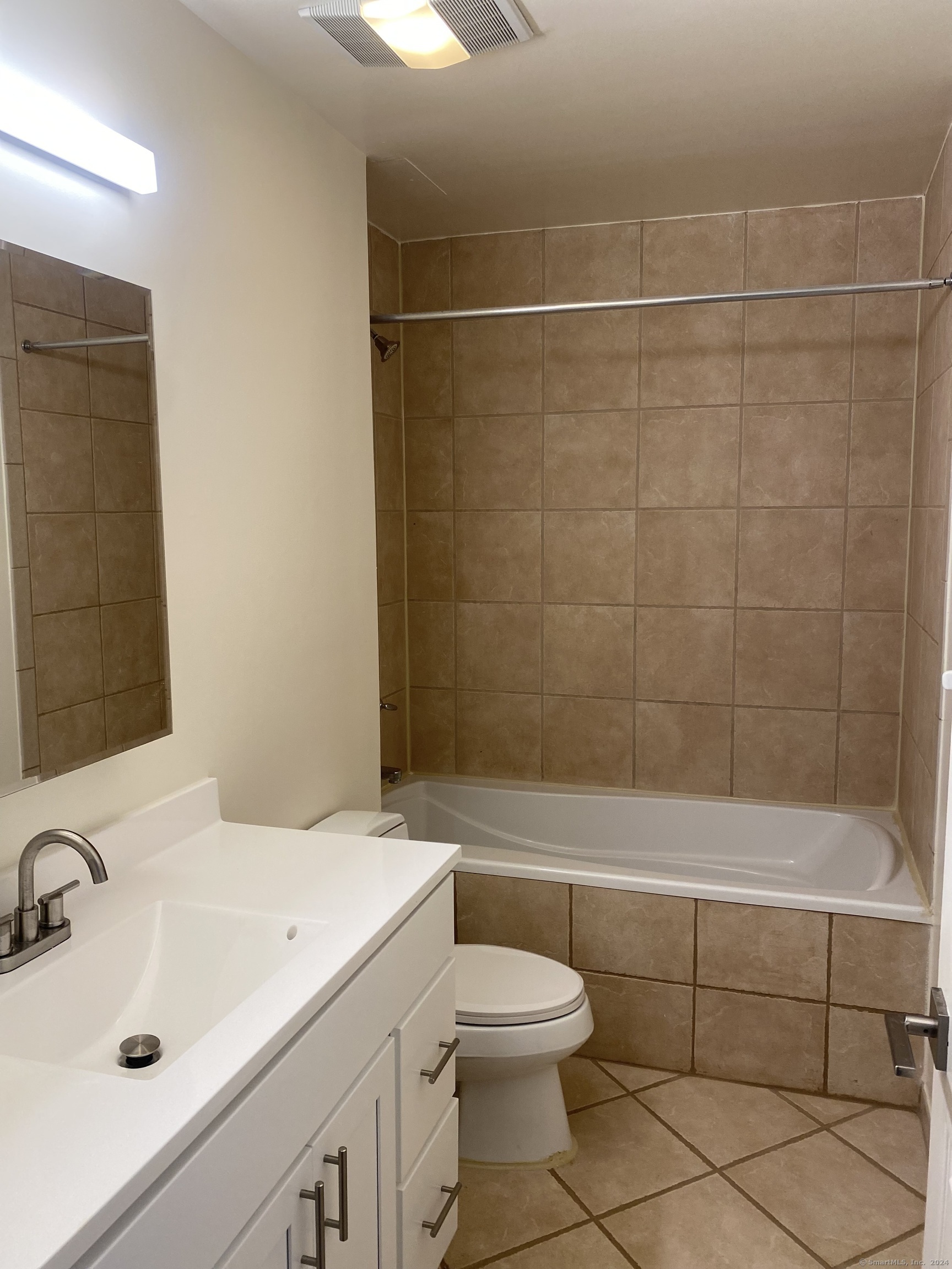 75 Prospect Street Stamford, CT 06901 - Photo 15 of 15 a bathroom with a sink a toilet and shower