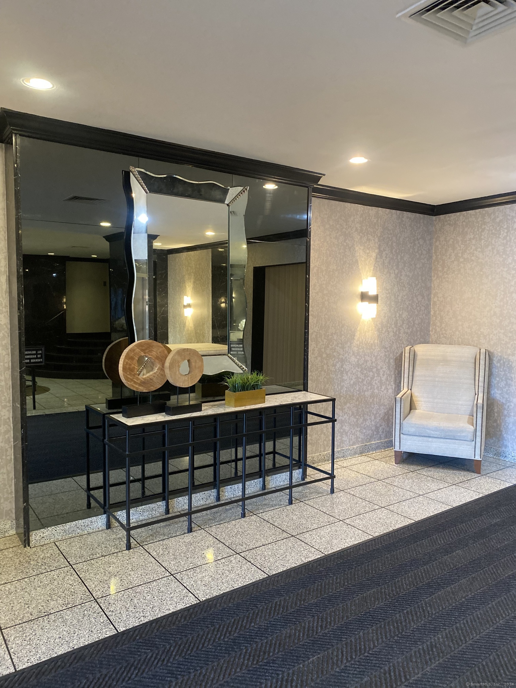 75 Prospect Street Stamford, CT 06901 - Photo 2 of 15 a view of a lobby area with furniture and wooden floor