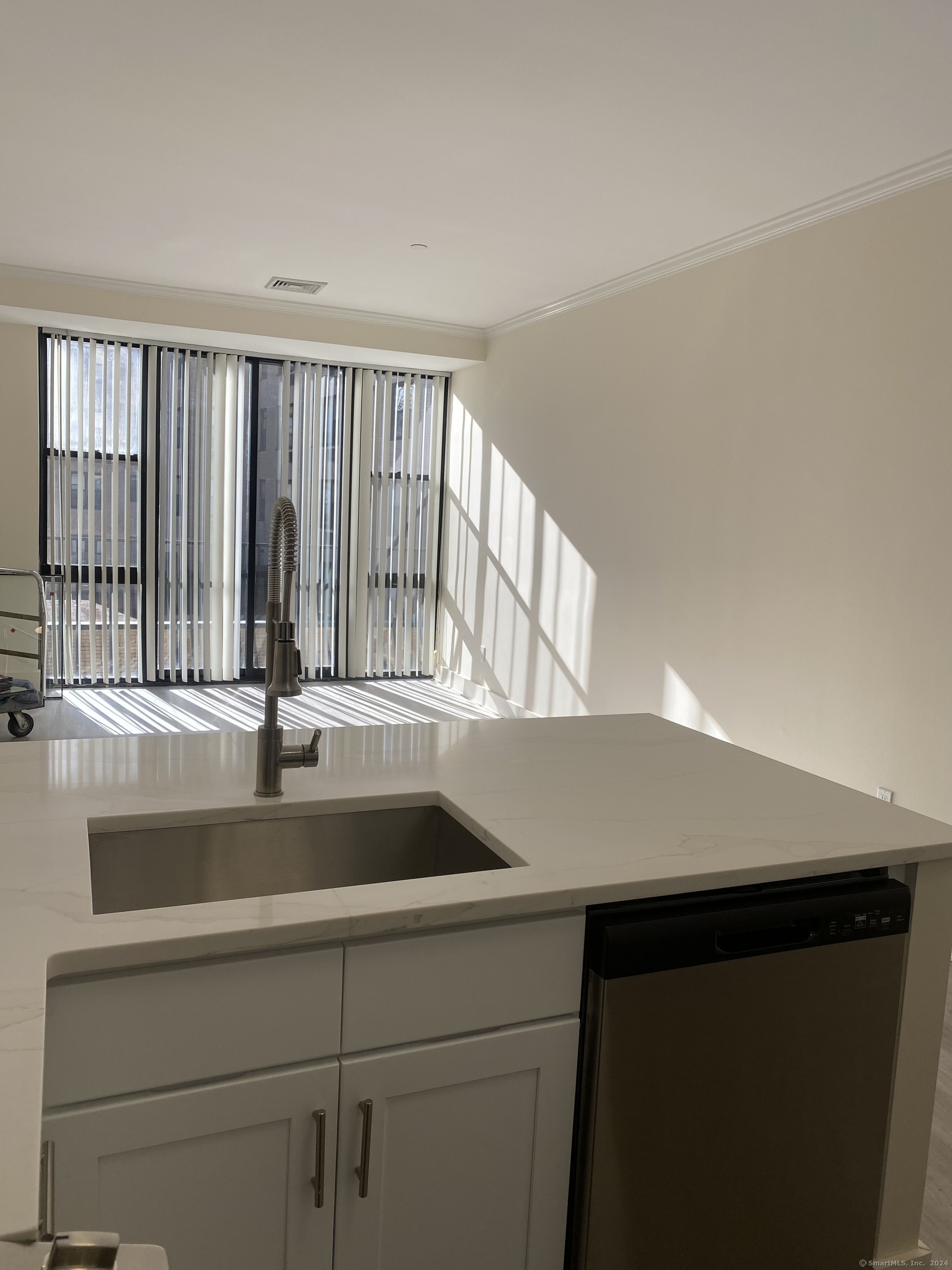 75 Prospect Street Stamford, CT 06901 - Photo 7 of 15 a view with a sink and dishwasher with wooden floor