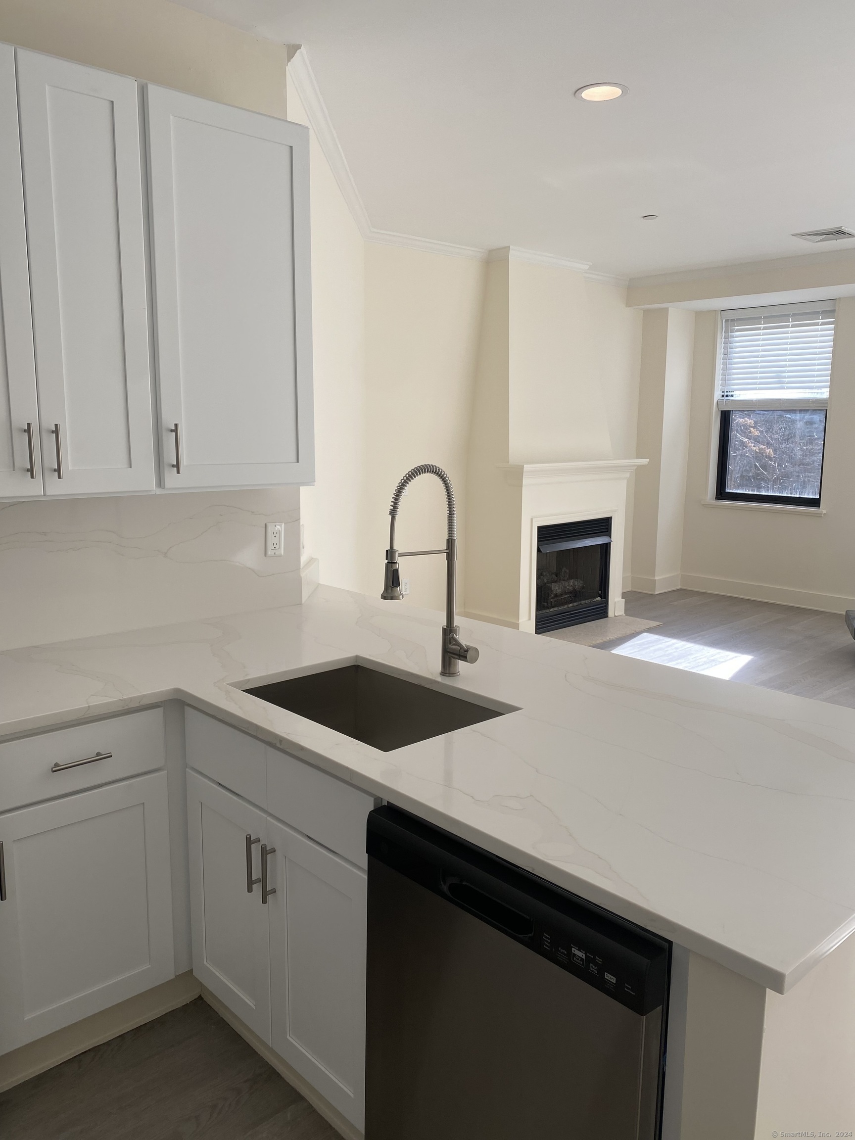 75 Prospect Street Stamford, CT 06901 - Photo 8 of 15 a kitchen with a sink cabinets and a stove