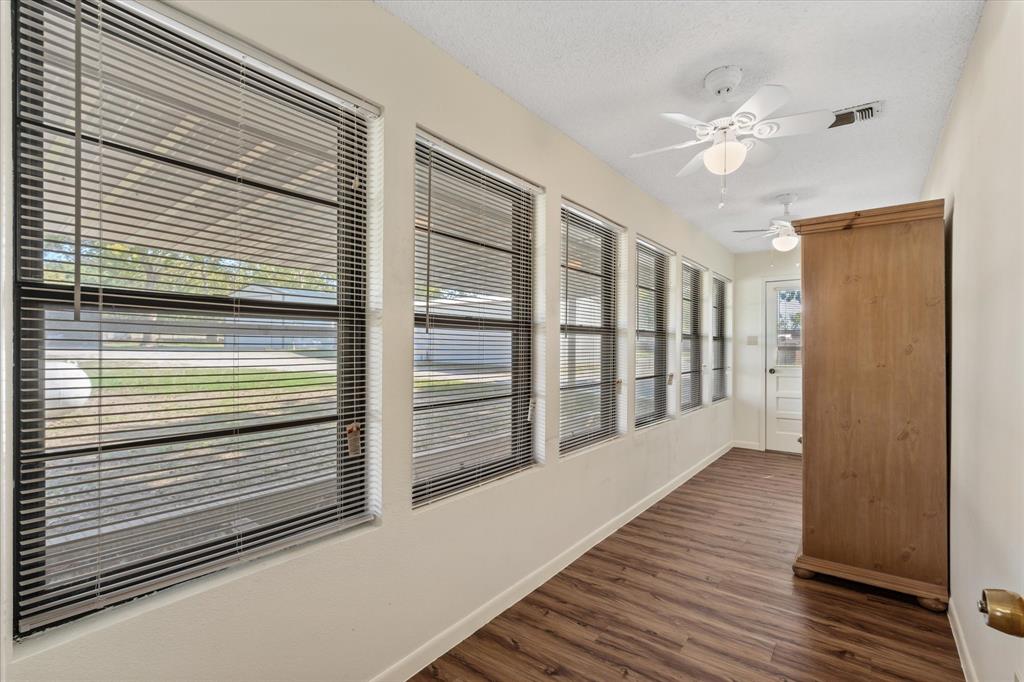 2711 Tin Top Road Weatherford, TX 76087 - Photo 15 of 22 a view of a balcony with wooden floor