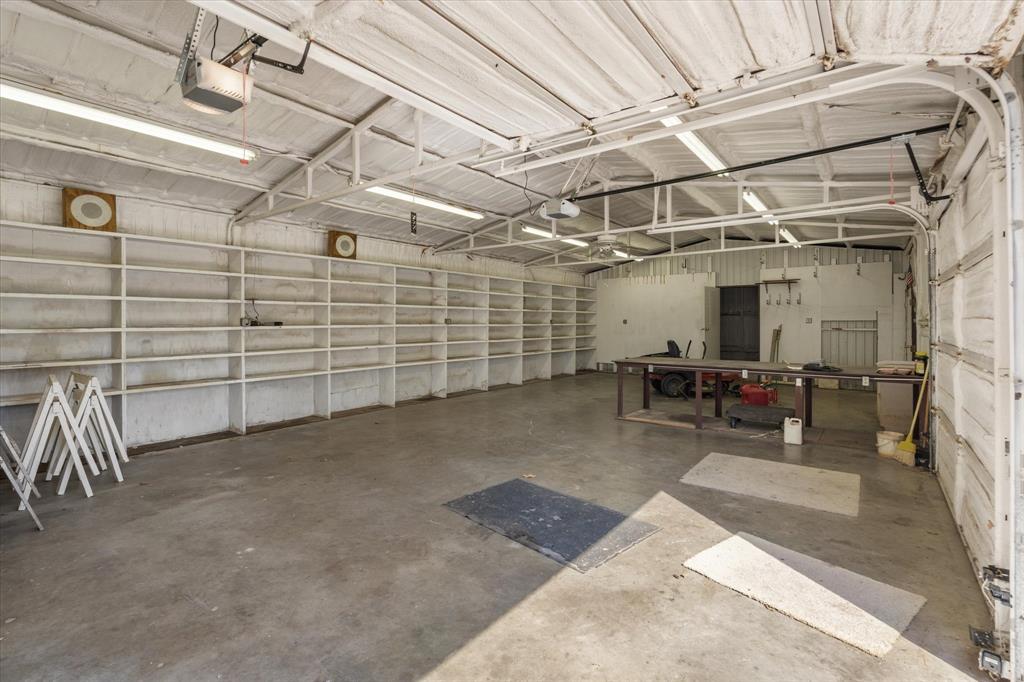 2711 Tin Top Road Weatherford, TX 76087 - Photo 22 of 22 a view of a garage with storage