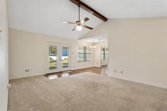 a kitchen with stainless steel appliances a refrigerator and a stove top oven