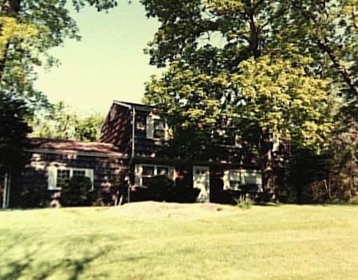 a view of a house with snow on the yard