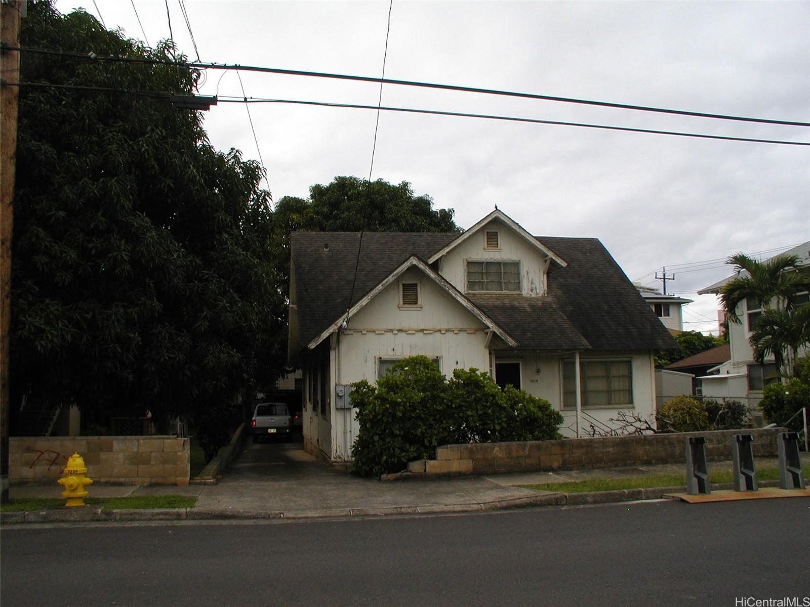 a view of a house with a street