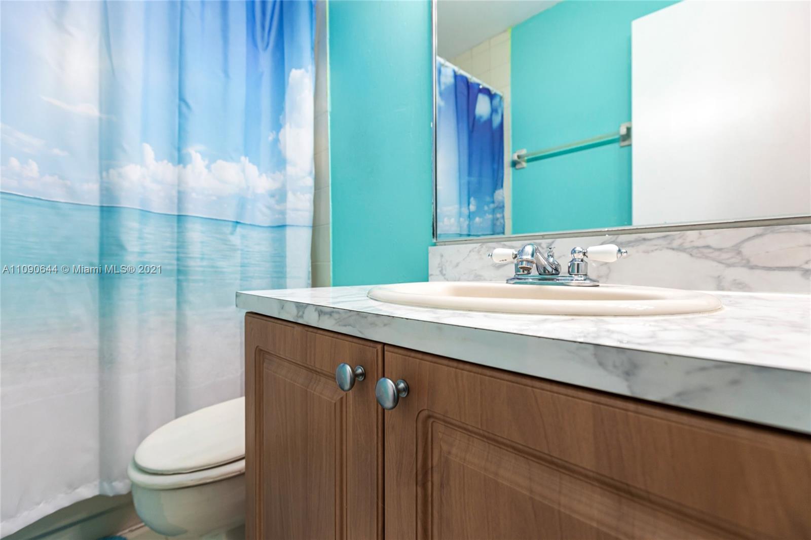 1925 Southwest 118th Court, Unit 138 Miami, FL 33175 - Photo 14 of 15 a bathroom with a sink and a mirror