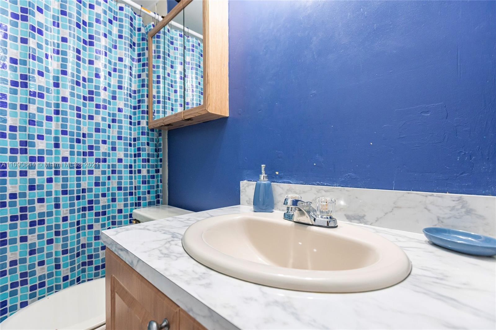 1925 Southwest 118th Court, Unit 138 Miami, FL 33175 - Photo 7 of 15 a bathroom with a sink and a mirror