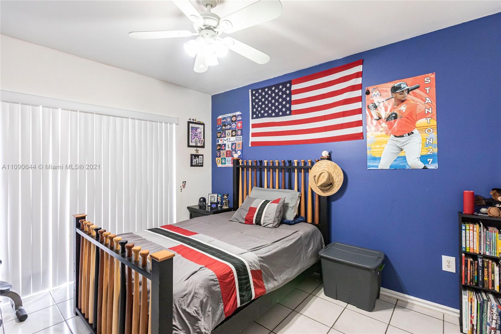 1925 Southwest 118th Court, Unit 138 Miami, FL 33175 - Photo 9 of 15 a bedroom with a bed and a chandelier