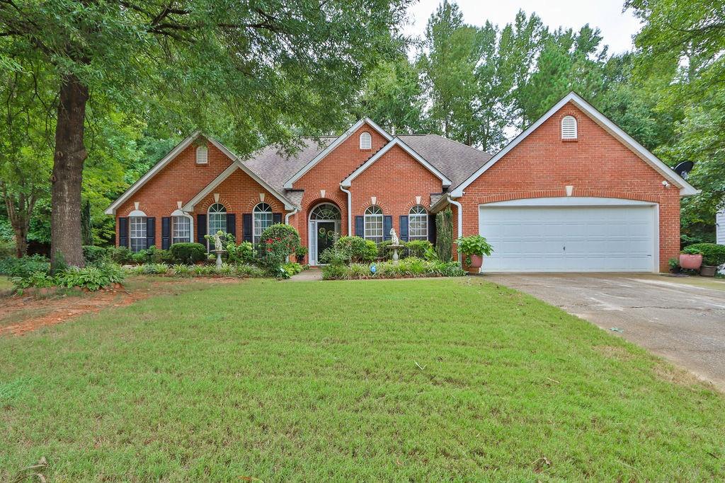 3671 Waldrop Farms Drive Decatur, GA 30034 - Photo 1 of 1 a front view of a house with yard and green space