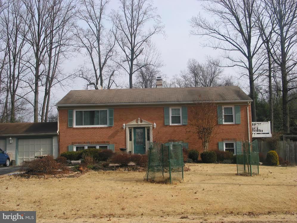 2416 Parallel Lane Silver Spring, MD 20904 - Photo 2 of 22 a front view of a house with a yard covered in snow