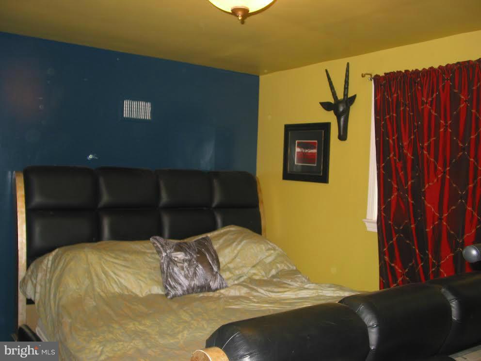 2416 Parallel Lane Silver Spring, MD 20904 - Photo 11 of 22 a bedroom with a bed and a window