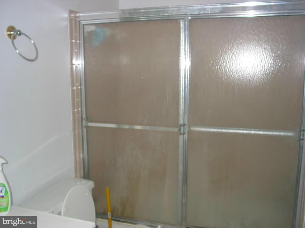 2416 Parallel Lane Silver Spring, MD 20904 - Photo 14 of 22 a bathroom with a glass shower door