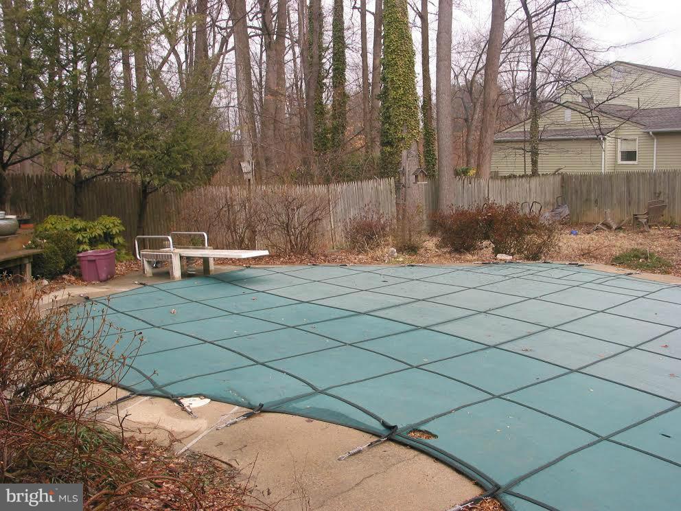 2416 Parallel Lane Silver Spring, MD 20904 - Photo 19 of 22 a backyard of a house with lots of green space and outdoor seating