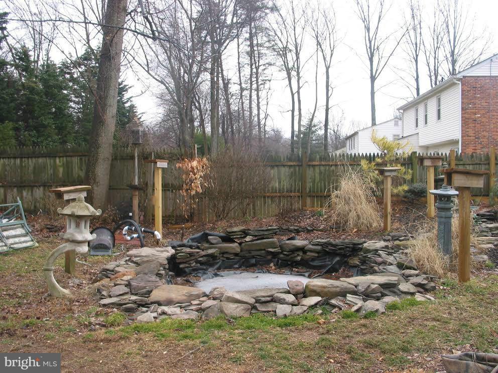 2416 Parallel Lane Silver Spring, MD 20904 - Photo 21 of 22 a backyard of a house with outdoor seating