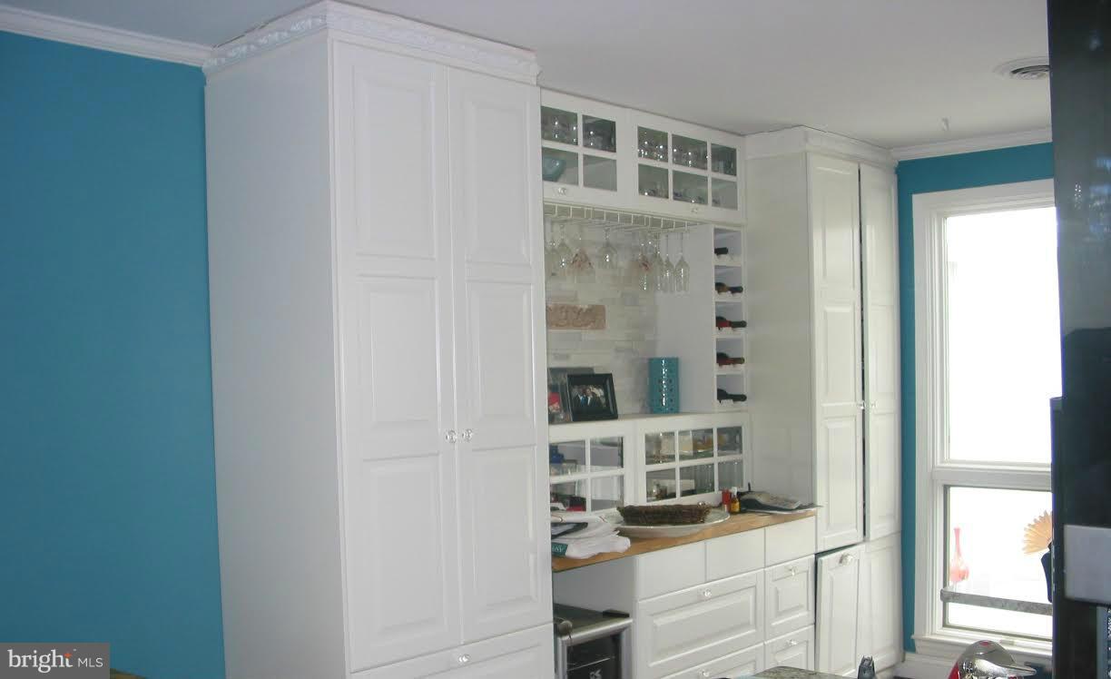 2416 Parallel Lane Silver Spring, MD 20904 - Photo 6 of 22 a kitchen with a refrigerator and cabinets