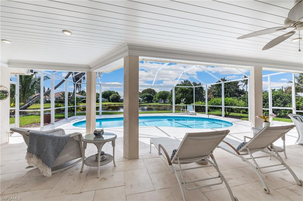 1904 Countess Court Naples, FL 34110 - Photo 14 of 33 a view of a patio with a table and chairs in front of it