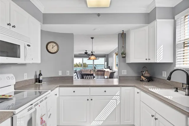 a kitchen with appliances cabinets and a sink