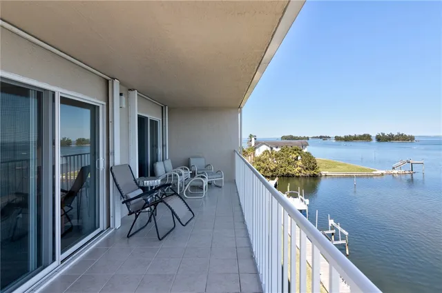 a balcony with an outdoor seating